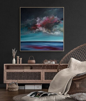 Textured moody cloudscape that looks like a storm is approaching with movement overlooking peaceful sea in rich teal and red tones.

