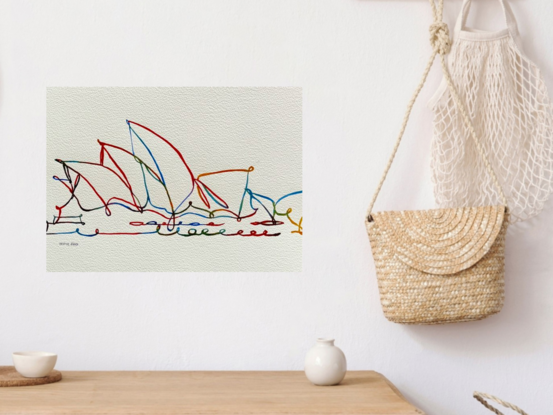 "Sail Symphony" captures the elegance of Sydney’s iconic Opera House in a vibrant and dynamic line art composition. This watercolour artwork uses intertwining lines and bright, playful colours to reflect the architectural beauty and rhythmic flow of the Opera House’s sails. The abstract portrayal invites viewers to see the landmark in a new, imaginative light, evoking movement and the harmonious connection between structure and the sea.