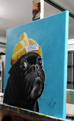 Cute pug in a yellow beanie!