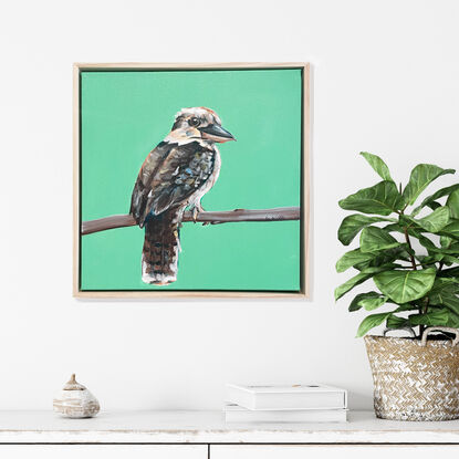 Australian Kookaburra standing in front of a rich modern green background