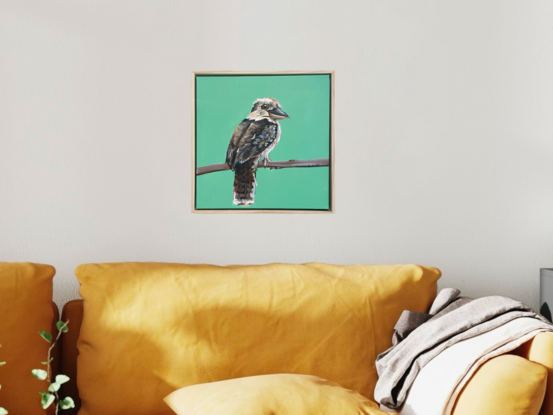 Australian Kookaburra standing in front of a rich modern green background