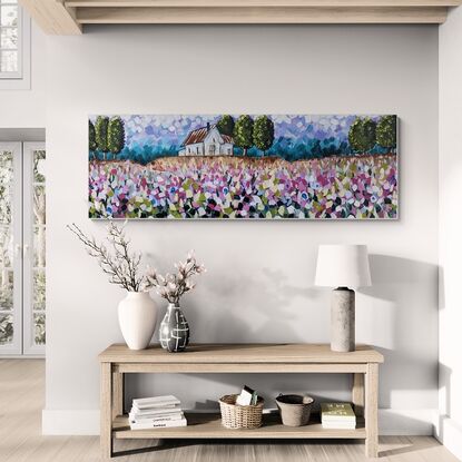 panoramic landscape of trees country house on a hill with field of flowers in foreground