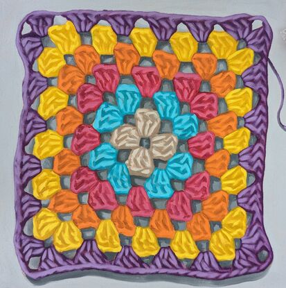 A crochet granny square with 6 rounds of pastel colours on a light grey background.