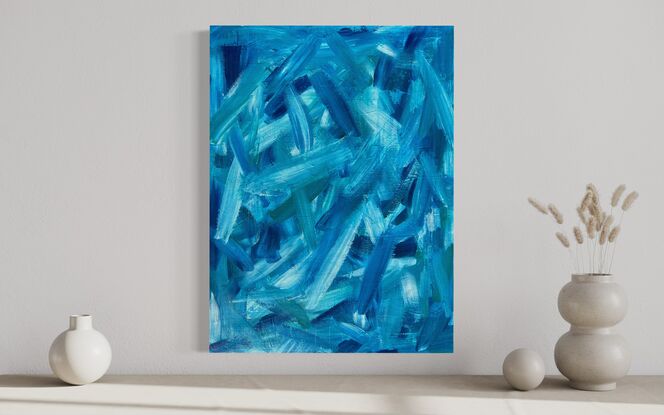 abstract art of large blue green brushstrokes floating across a wood board 