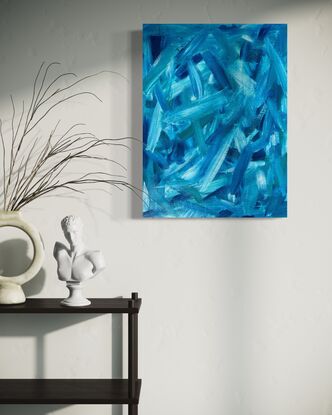 abstract art of large blue green brushstrokes floating across a wood board 