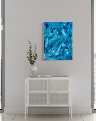 abstract art of large blue green brushstrokes floating across a wood board 