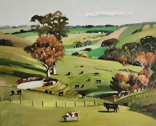 Rural Australia with green rolling hills and paddock. Cows are scattered throughout the scene.