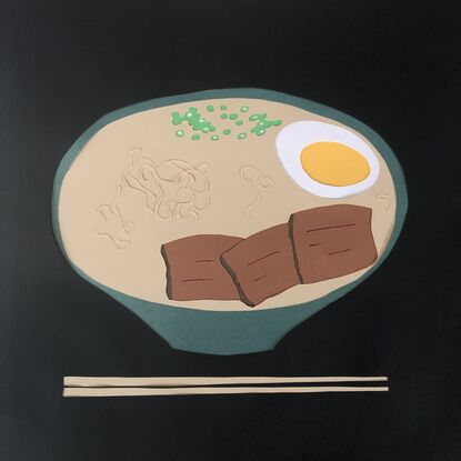 Japanese ramen in green bowl with chopsticks on black background