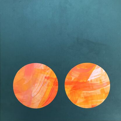 Orange circles with a dark teal base and negative space. 