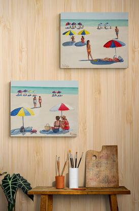 Peope sunbathing on the beach in the sixties under beach umbrellas.