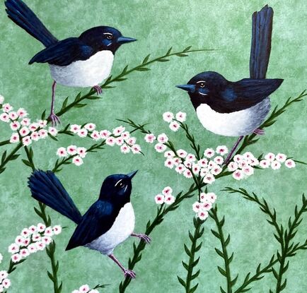 A family of three Willy Wagtails sitting together on pink and white flowers on a pale green background. The image is stretched around to cover the sides of the canvas. The birds are black and white and they are sitting on pink and white flowering branches. 