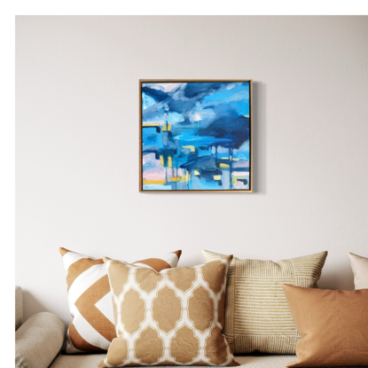 Two small row boats against an expressive abstract blue sky storm out on the blue ocean