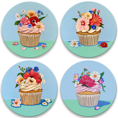 One of four whimsical cupcake paintings, adorned with flowers on circular board, because "happiness is only a cupcake away!"