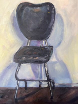 A painting of a chair in the studio.