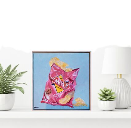 Smith's Salt and Vinegar chip pack on blue background 