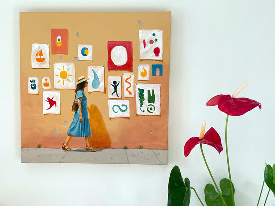 We see a woman walking next to a wall, covered in posters. The posters show big, almost abstract symbols in bright colours. It seems like the hottest part of day, with the sun beating down. The central figure is wearing a swishy blue dress.