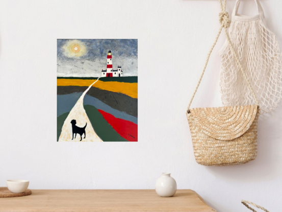 A naive style palette knife painting showing a countryside scene with colourful fields of green, red, blue and ochre, beside a long white yellow path, where a black dog is walking with its back view to the viewer, the path leads to a red and white lighthouse in the far distance. The sky is a mixture of greys with a full moon in the sky. 