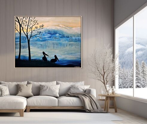 This artwork features a serene, wintry landscape, inspired by the artist's travels through New Zealand. The mountain range in the background, softly covered in snow, reflects the fresh, crisp atmosphere of icy mornings in the region. The hues of blue dominate the scene, evoking the cold, tranquil beauty of the landscape. The sky transitions from soft yellow to cool blues, suggesting the early hours of sunrise or sunset, when the sun gently lights the frosted environment.

In the foreground, silhouetted against this backdrop, stand two pelicans beside bare trees. Their dark forms provide striking contrast and depth, capturing a peaceful moment by the lakeside. The pelicans represent life and stillness, standing against the vast, cold wilderness beyond. The use of silhouette gives the artwork a contemplative, quiet tone, while the color palette reflects the chilly, fresh feeling of a New Zealand winter morning. The artist's experience of awe at the stunning views and mountain ranges comes through in the artwork’s quiet majesty, where nature's beauty is both stark and peaceful.