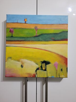 Small yellow landscape painting of fields 