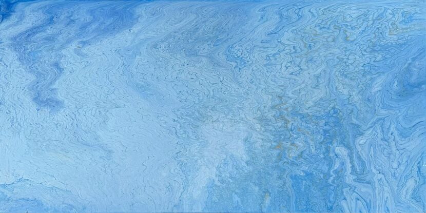 A close-up of an acrylic fluid art painting titled “Blue Veil.” The image features intricate, flowing patterns of various blue shades interwoven with subtle hints of grey and gold. The composition resembles delicate, wave-like veining across the canvas, evoking a sense of tranquility and fluidity.