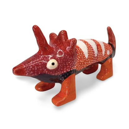 The Spotted Wombat features a playful, abstract rendition of a wombat, glazed in a striking deep blue with contrasting white circular spots and a red snout.