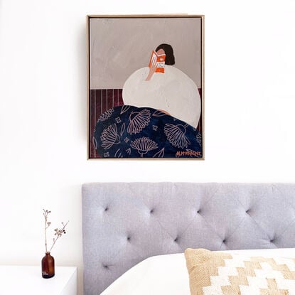 Blue background, woman reading book