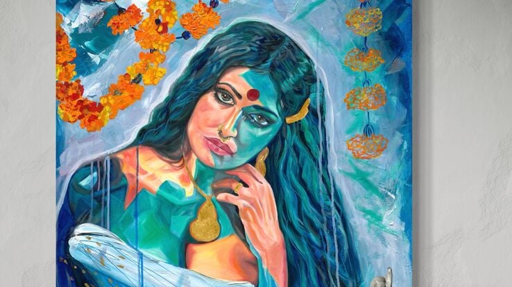 A captivating mixed media painting of a woman with gold accents and marigold flowers, rendered in bold hues of blue and orange, showcasing her introspective gaze and cultural elegance against a textured background.