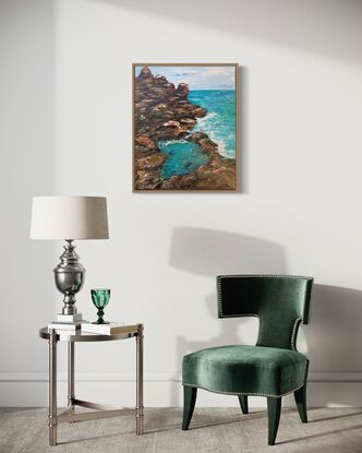 The painting depicts a beautiful seascape with a large rock formation dominating the left side of the canvas. The rock is textured and imposing, with jagged edges and crevices that have been expertly rendered with a palette knife. The rock has a mix of warm and cool tones, with rust-colored earth and grey-blue stone, and a few tufts of green foliage sprouting from its surface.

On the right side of the canvas, there is a wide expanse of deep blue sea, its surface rippling with small waves that catch the light and reflect the sky. The palette knife has been used to create a sense of movement and texture in the water, with thick, swirling strokes of paint that give the impression of currents and eddies.

In the distance, towards the center of the painting, there are two small figures. They are women, their silhouettes blurred and indistinct, as if they are some distance away. One seems to be standing, while the other is seated, perhaps on a rock or on the sand. One of them facing towards the sea, as if lost in contemplation of its vastness. There is a small natural pool in the Center that is deeper blue green in colour giving the impression of stagnant water.

The overall effect of the painting is one of serenity and grandeur, with the rock formation and sea conveying a sense of the power and majesty of nature. The use of the palette knife has given the painting a tactile quality, with the thick layers of paint creating a textured surface that invites the viewer to reach out and touch it.