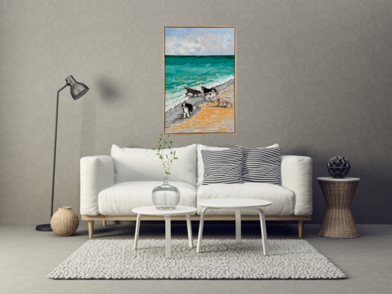 A group of five dogs romping on the beach and playing in the waves.