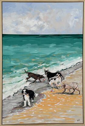 A group of five dogs romping on the beach and playing in the waves.