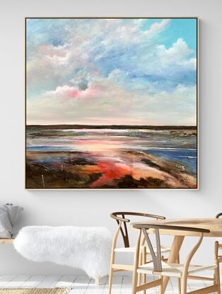 Colourful Textured abstract landscape with fluffy vibrant hot pink  white and blue fluffy clouds above a sunset filled landscape with blue water flowing through.