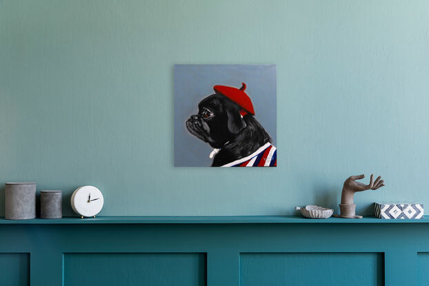 Gorgeous black pug wearing red beret and sporting a strip