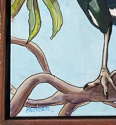 Two paintings that hang side by side. On each painting there is a close up of a magpie sitting on the branches of a gum tree.  Both magpies show all the blues and greens that can be seen amongst their black and white feathers when the sun is shining on them. 