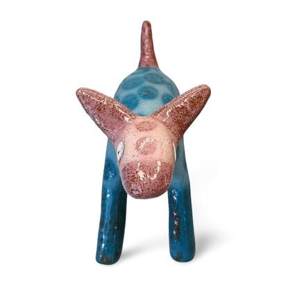 This stoneware sculpture features a stylised puppy.