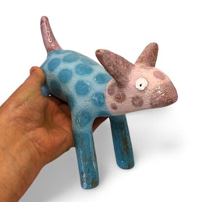 This stoneware sculpture features a stylised puppy.