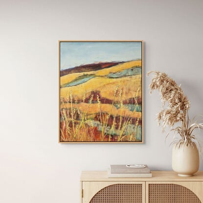 rich golden and red ochre landscape with pale yellow highlights and golden yellow grasses in the foreground