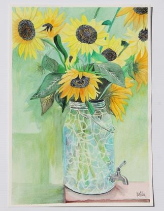 Yellow sunflowers in crackled glass jar