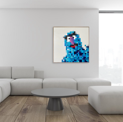 Blue Muppet Herry Monster sitting on a white background