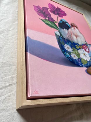 Fairy-wren couple on blue floral teacup.