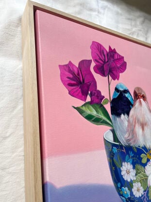 Fairy-wren couple on blue floral teacup.