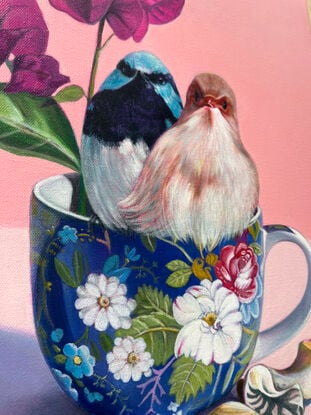 Fairy-wren couple on blue floral teacup.