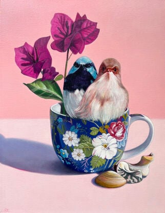 Fairy-wren couple on blue floral teacup.