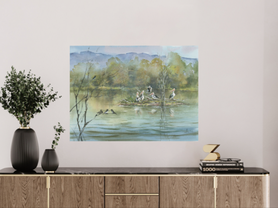 Watercolour painting of a lake, billabong with pelicans, birds, trees and escarpment in the background.