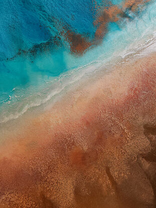 Textured aerial view inspired by a crystal clear beach and surfer.