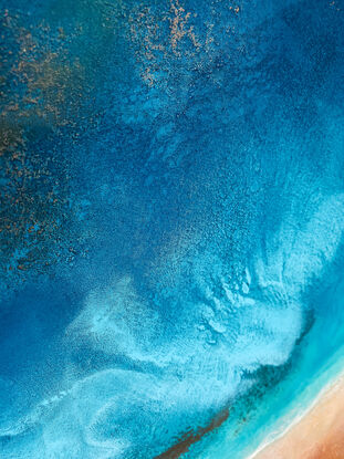 Textured aerial view inspired by a crystal clear beach and surfer.