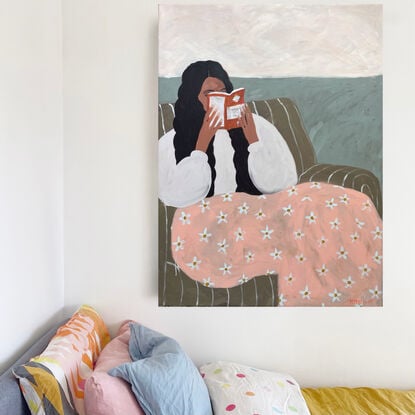 Beige background, woman reading book