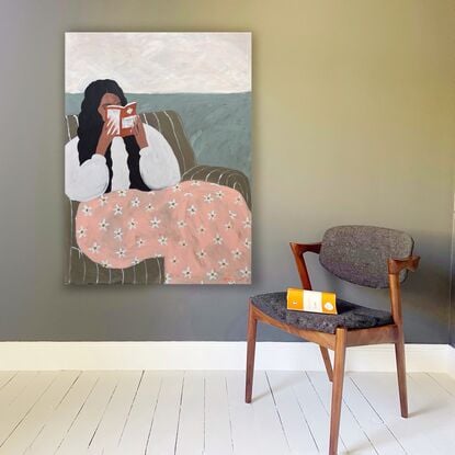 Beige background, woman reading book