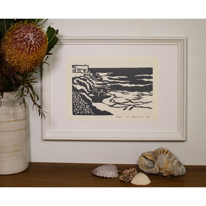 A linocut print depicting the beautiful tamarama beach. 