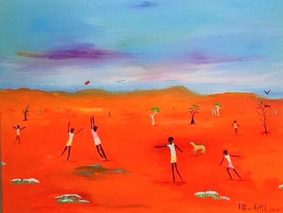 Youths playing Footy in Outback Australia.