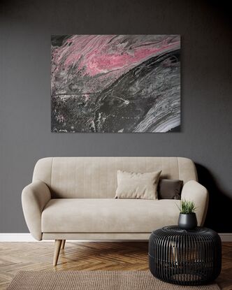 A fluid art painting featuring swirling patterns of black, grey, and pink acrylic paint on canvas. The composition resembles a flowing, abstract landscape with a dynamic contrast between dark and light tones, evoking a sense of movement and depth.